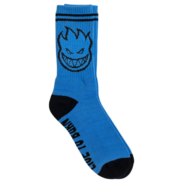 A blue sock with a black face on it, designed as the SPITFIRE BIGHEAD SOCK LIGHT BLUE / BLACK.