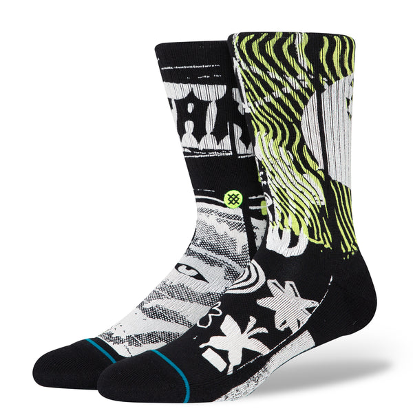 A pair of STANCE DISTORTED BLACK LARGE socks with a design on them.
