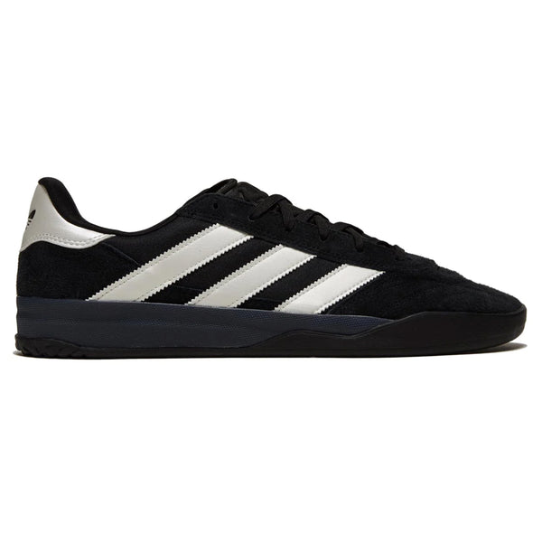 A black ADIDAS COPA PREMIERE CORE BLACK / ZERO METALLIC / SPARK sneaker with a white striped design, CORE BLACK sole, and black laces, viewed from the side.