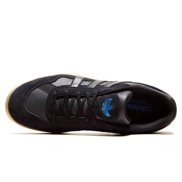A pair of ADIDAS GONZ ALOHA SUPER BLACK / CARBON / GUM sneakers with a black suede upper, offering a regular fit.