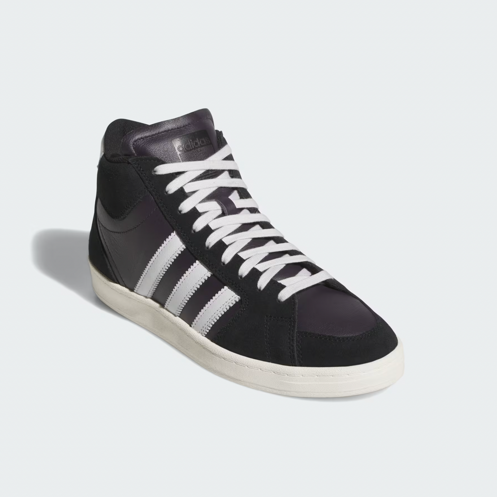 The ADIDAS SUPERSKATE ADV in Core Black, Crystal White, and Off White features a suede upper, white laces, signature white stripes, and a white rubber sole—ideal for stylish skateboarding. Shown on a plain light background.