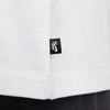 Close-up of a white NIKE SB LOGO SKATE TEE WHITE t-shirt with a black 'NIKE SB' logo on the hem, a skate staple.