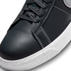 A close up of a black and white Nike SB Blazer Mid X Mason Silva Blacked Blue / Wolf Grey sneaker.