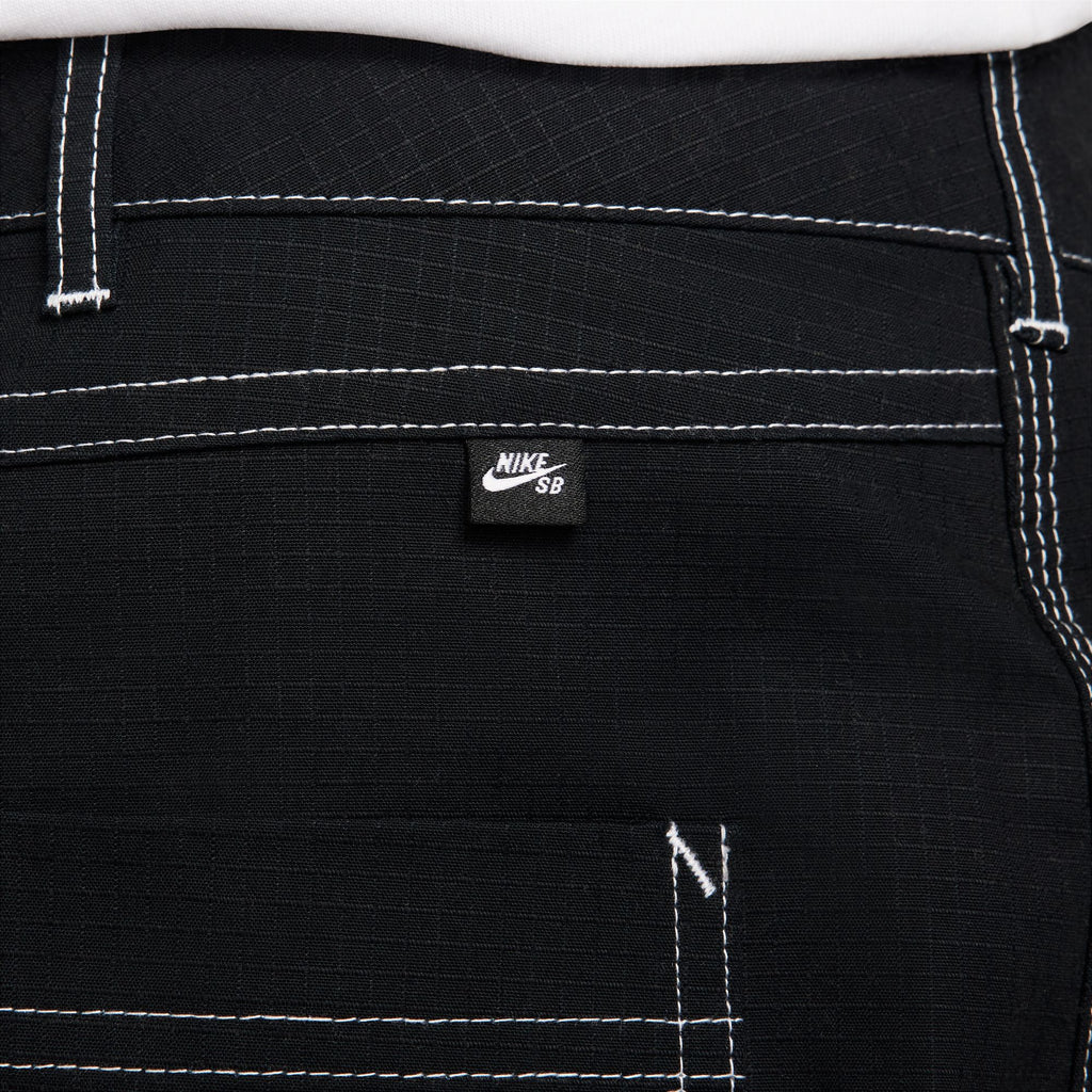 The durable back pocket of a black nike SB Double Knee Skate Pants for easy storage.