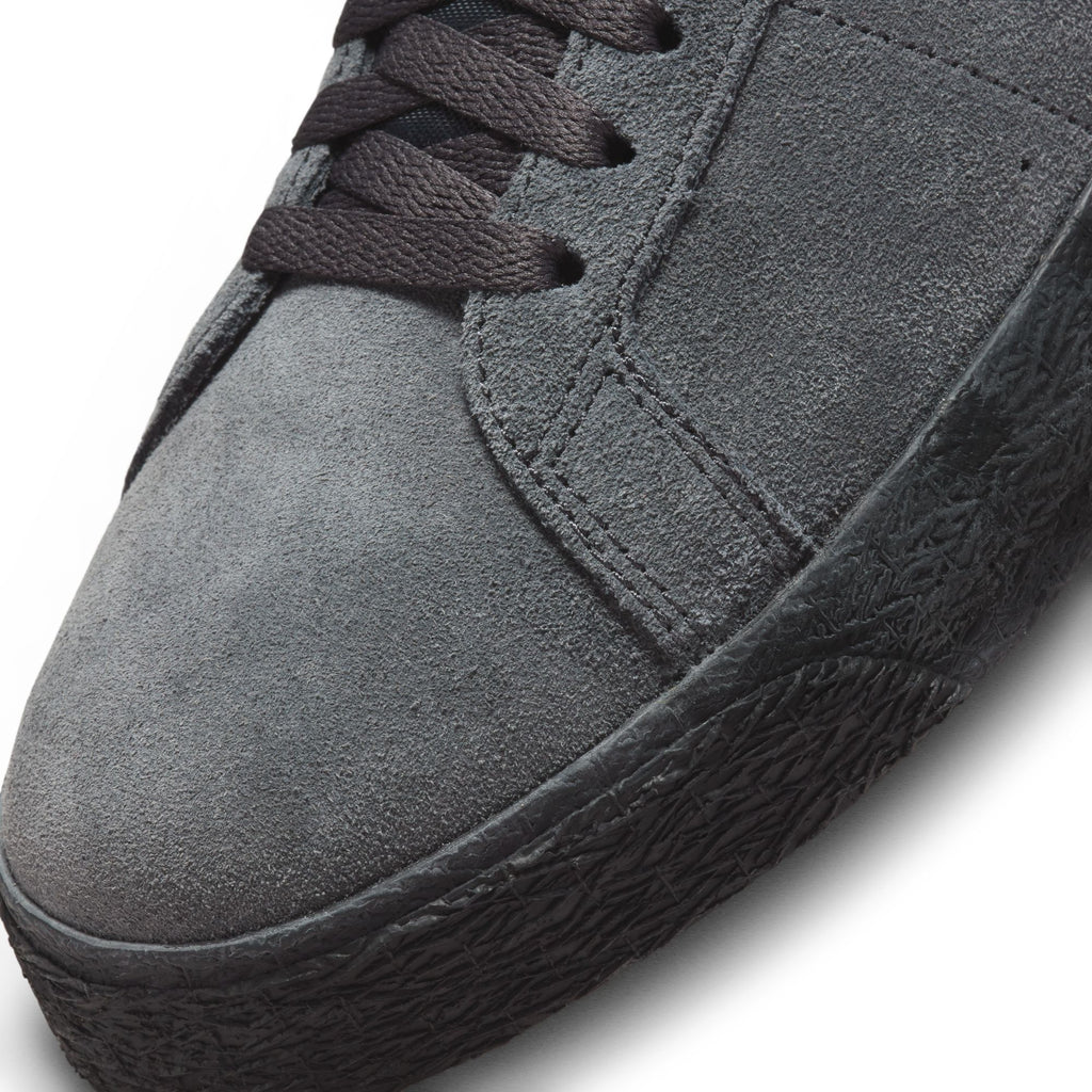 A close up of a NIKE SB BLAZER MID ANTHRACITE/BLACK sneaker.