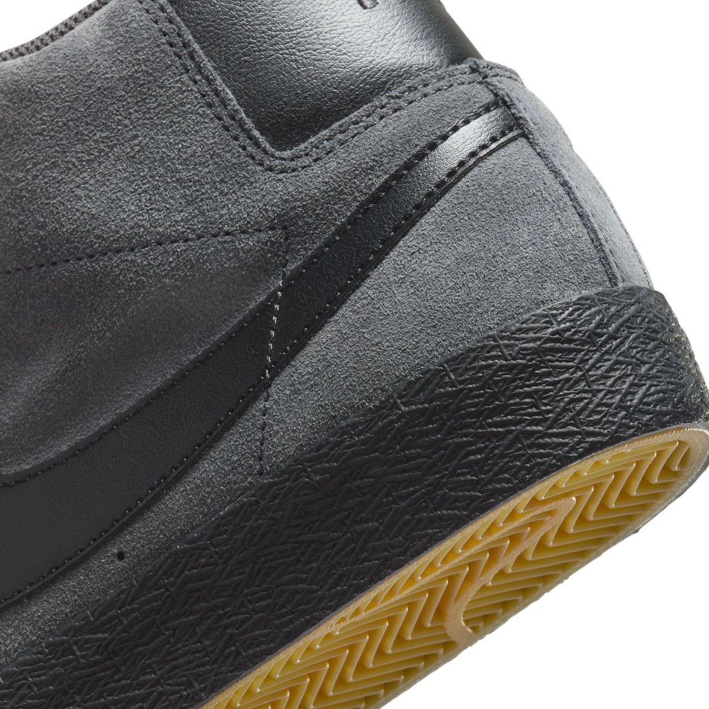 The NIKE SB BLAZER MID ANTHRACITE/BLACK in grey and yellow.