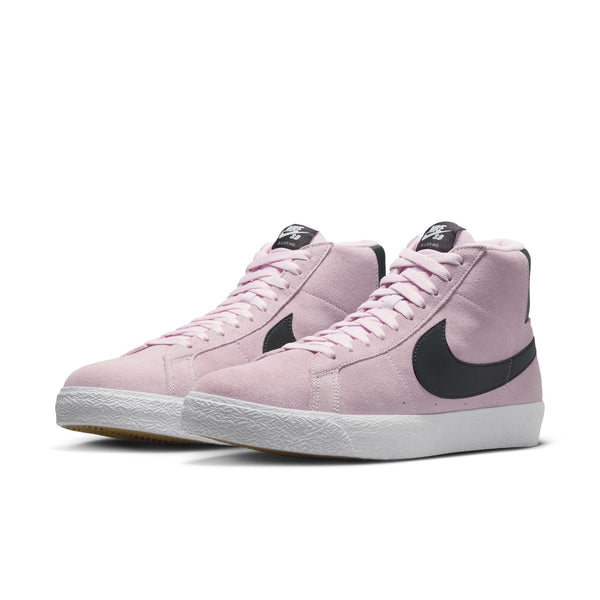 The nike SB Blazer Mid Pink Foam/Anthracite-White-Gum Yellow features a light pink suede upper, black Swooshes, white midsoles, Zoom Air cushioning, and gum rubber outsoles, displayed against a plain white background.
