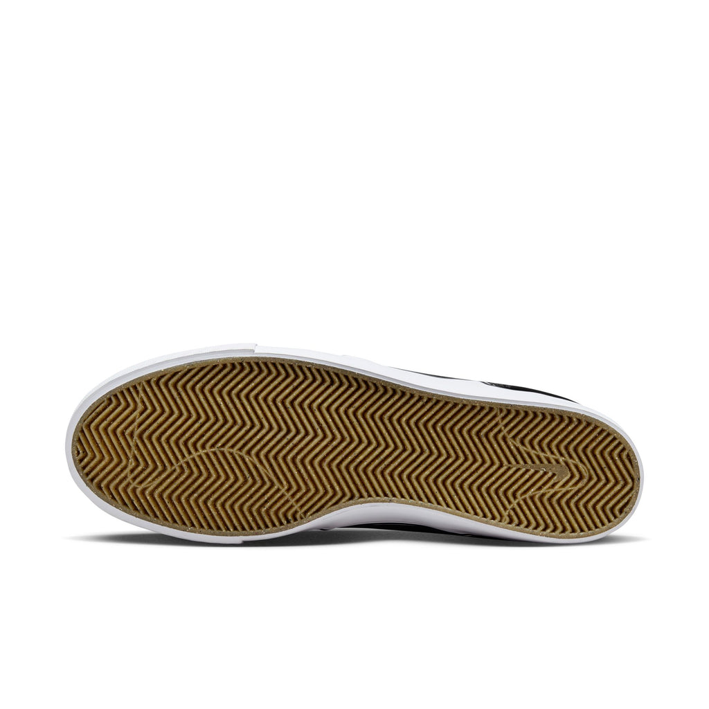 A pair of black and gold NIKE SB ZOOM JANOSKI OG+ BLACK / WHITE-BLACK sneakers by nike on a white surface.