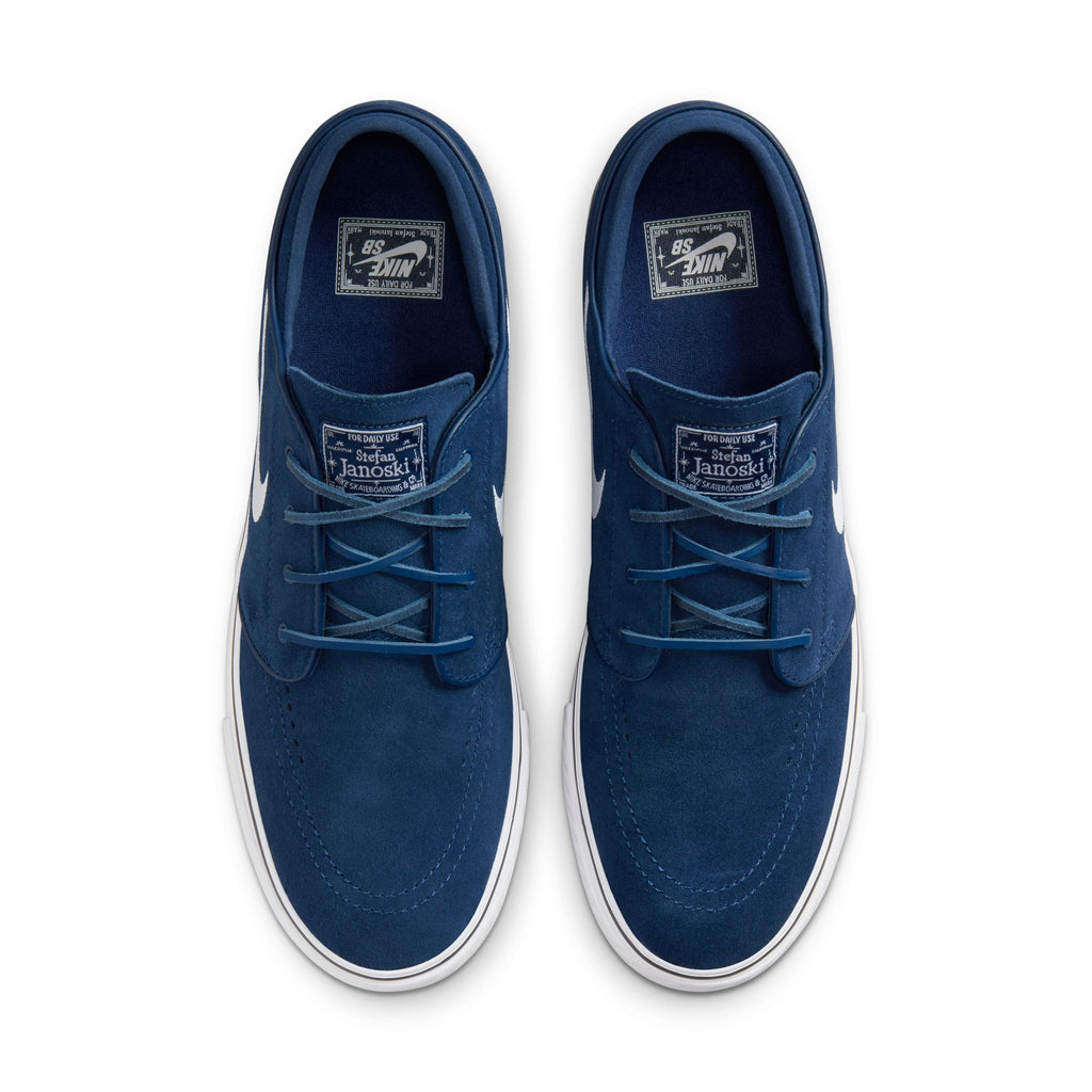 A pair of blue nike sneakers seen from above, designed for skateboarding with Zoom Air cushioning.