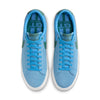 A pair of Nike NIKE SB BLAZER LOW PRO UNIVERSITY BLUE / BICOASTAL blue suede sneakers with laces viewed from above, featuring Zoom Air cushioning.