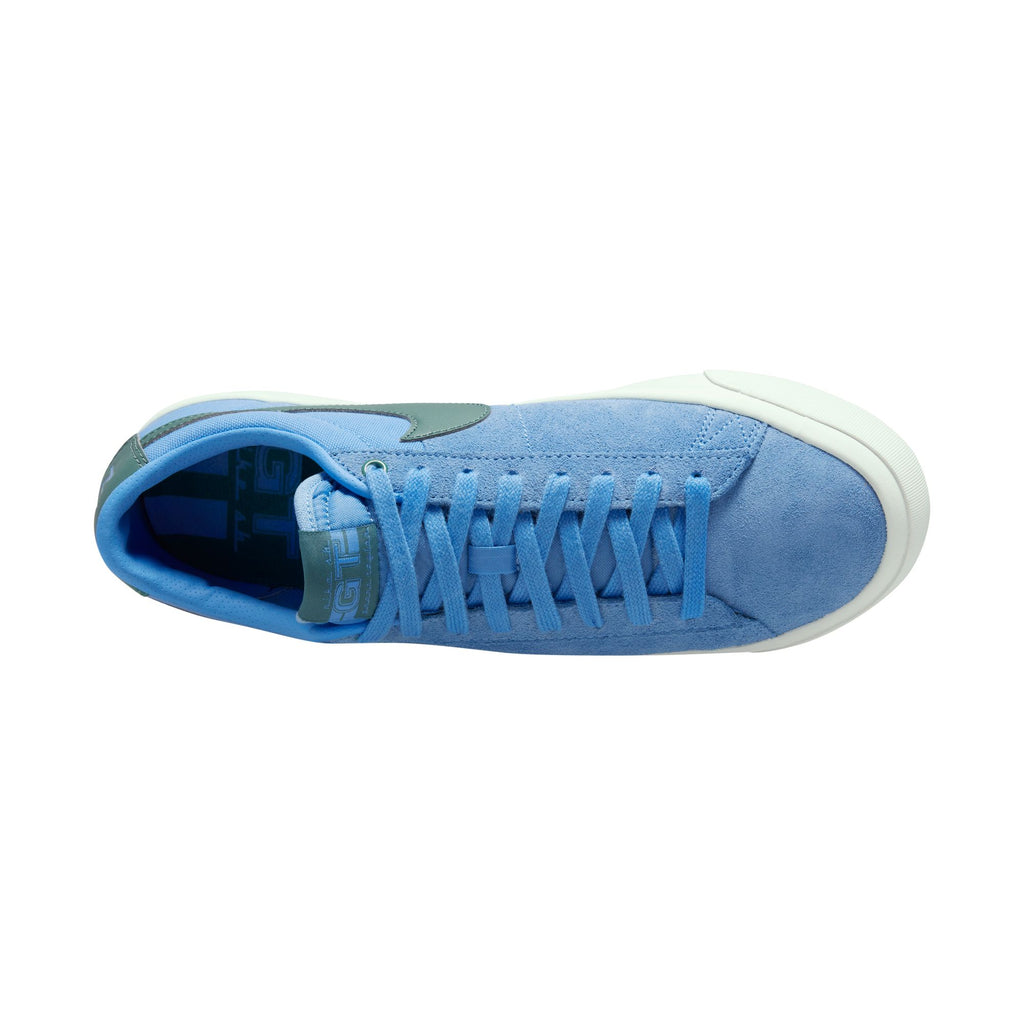 Top view of a blue suede Nike SB Blazer Low Pro University Blue / Bicoastal sneaker with white vulcanized construction sole.