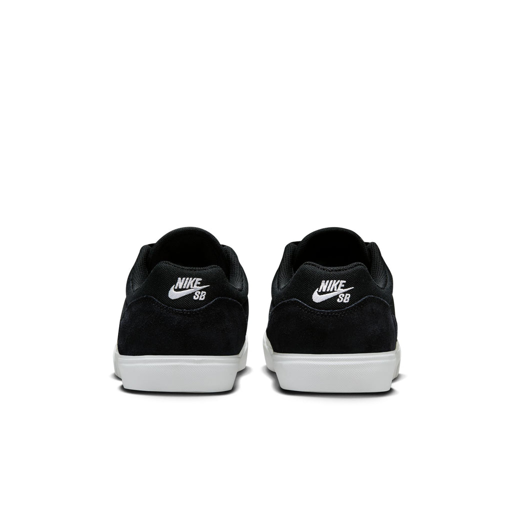 Back view of the NIKE SB MALOR BLACK / WHITE sneakers by Nike, showcasing a durable skate shoe design with white soles and the Nike SB logo on the heel.