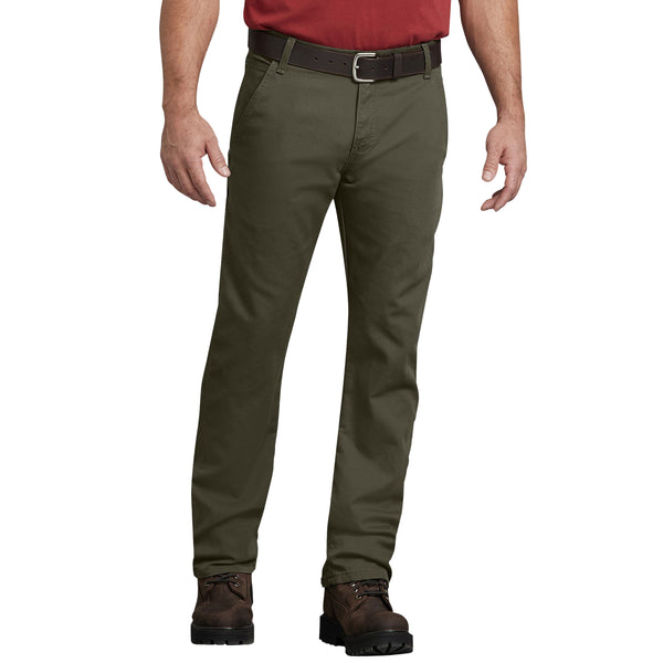 A man wearing DICKIES REGULAR FIT DUCK CARPENTER PANT MILITARY GREEN pants and a red shirt.