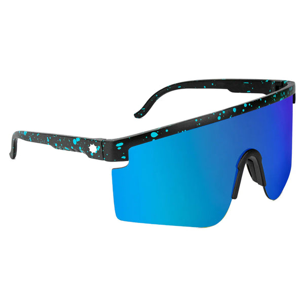 Single-lens GLASSY MOJAVE BLACK / BLUE MIRROR sunglasses with a blue tint and black frame speckled with white dots, isolated on a white background.