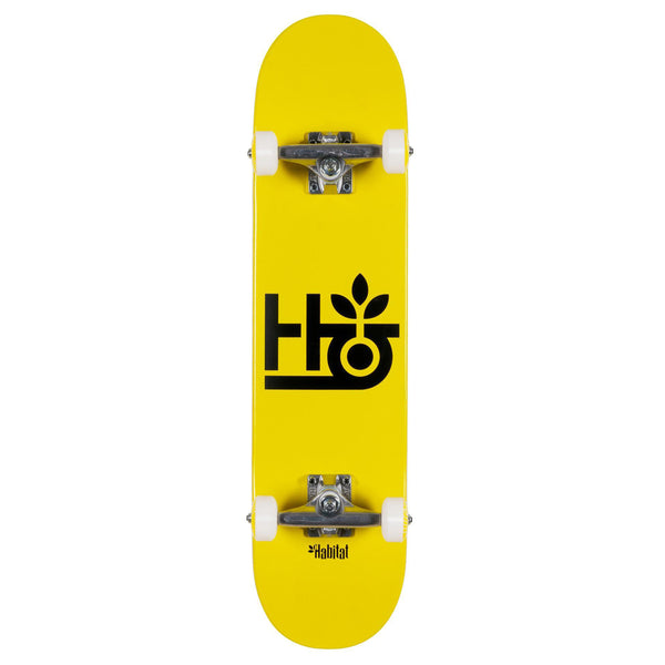 A Habitat Habitat Pod Complete Yellow skateboard with black graphics and text, featuring metal trucks and white wheels.