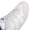 A zoomed in image of the white laces on the shoe with a suede toe cap.