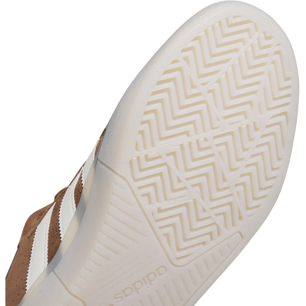 A pair of ADIDAS TYSHAWN PRELOVED BROWN / WHITE sneakers with Adiprene cushioning.