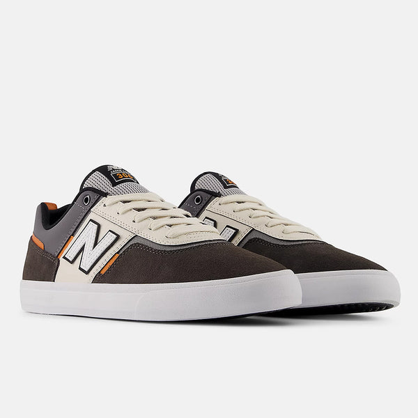 The NB NUMERIC FOY 306 in Black Cement/Sea Salt offers Jamie Foy’s signature style and durability, featuring black, white, and beige panels with orange accents—ideal for skate enthusiasts seeking high-performance footwear.