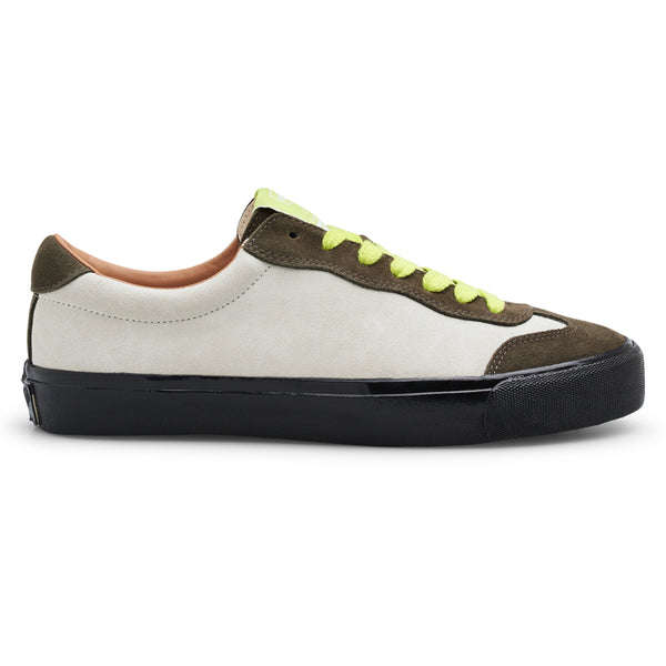 A white and green LAST RESORT AB VM004 MILIC OLIVE / CREAM / BLACK sneaker with black laces made of suede material.