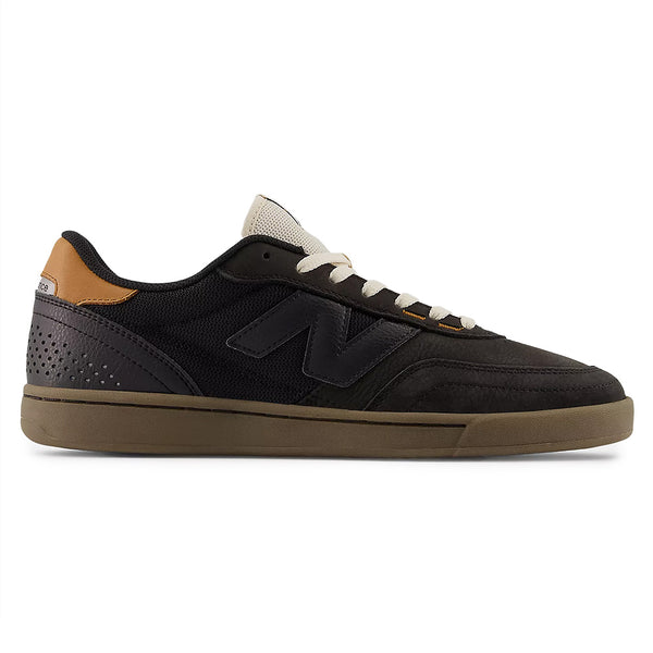 The NB NUMERIC 440 V2 BLACK skate shoe features a black mesh and suede upper, gum sole, brown heel detail, and white laces in a side profile—ideal for everyday skaters.