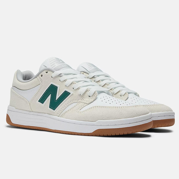 The NB Numeric 480 sneakers in Sea Salt and Vintage Teal feature a green "N" logo, white laces, and a brown sole. Enhanced with FuelCell foam for optimal comfort, these shoes are elegantly displayed on a plain background.