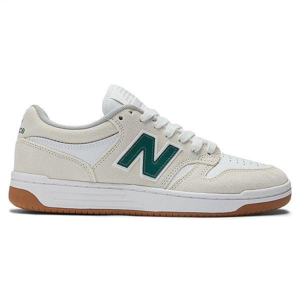The NB Numeric 480 Sea Salt/Vintage Teal sneakers feature a white and beige design with green accents, a gum sole, and a large "N" logo, inspired by heritage hightop basketball shoes.