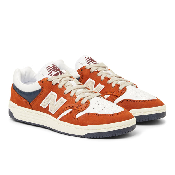 NB NUMERIC men's sneakers in orange and blue.