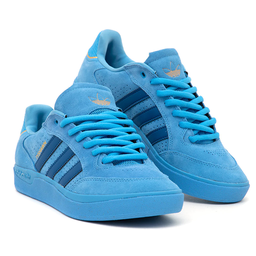 A pair of black ADIDAS TYSHAWN LOW BLUE / ROYAL BLUE sneakers with matching laces against a white background.