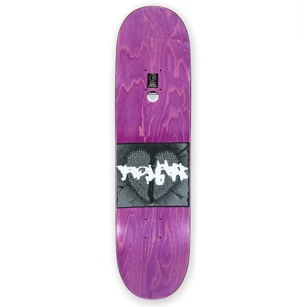 The top purple stain of a skateboard deck with a blurry image on it. 