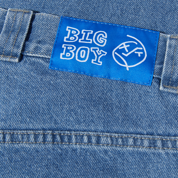 A close up of a POLAR BIG BOY MID BLUE label on a pair of blue jeans.