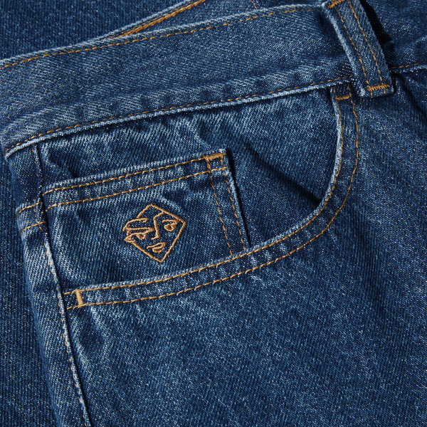 Close-up of POLAR '89! DENIM DARK BLUE denim with a stitched logo on the pocket.