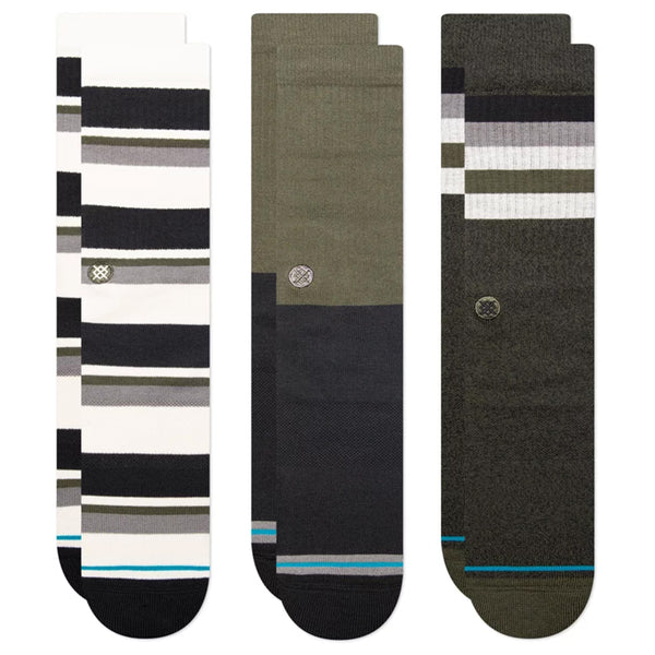 Three pairs of different green, grey, black, and white striped socks.