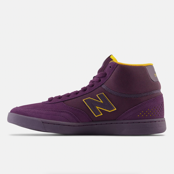 The inside view of an all purple high top show with yellow accents.