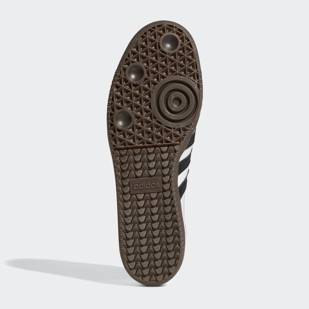 A pair of ADIDAS SAMBA ADV WHITE / BLACK shoes with black soles on a white background.