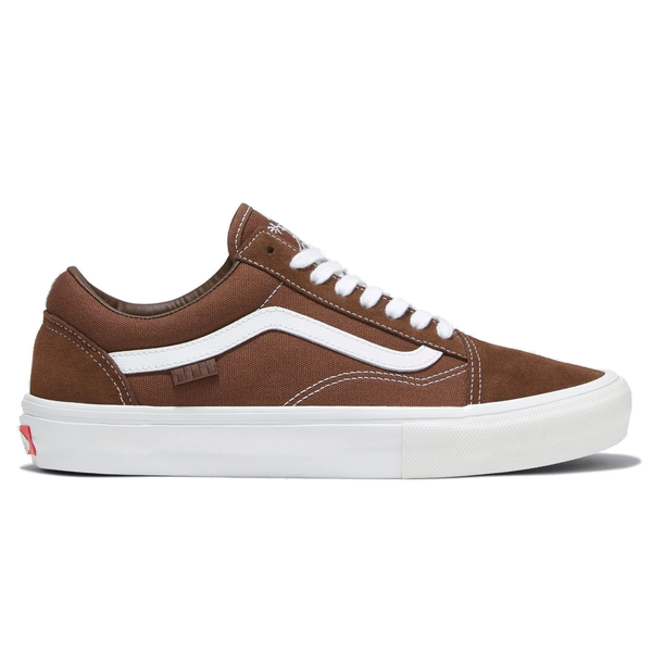 A dark brown canvas/suede shoe with a white sole, white laces, and a white wave mark on the side.