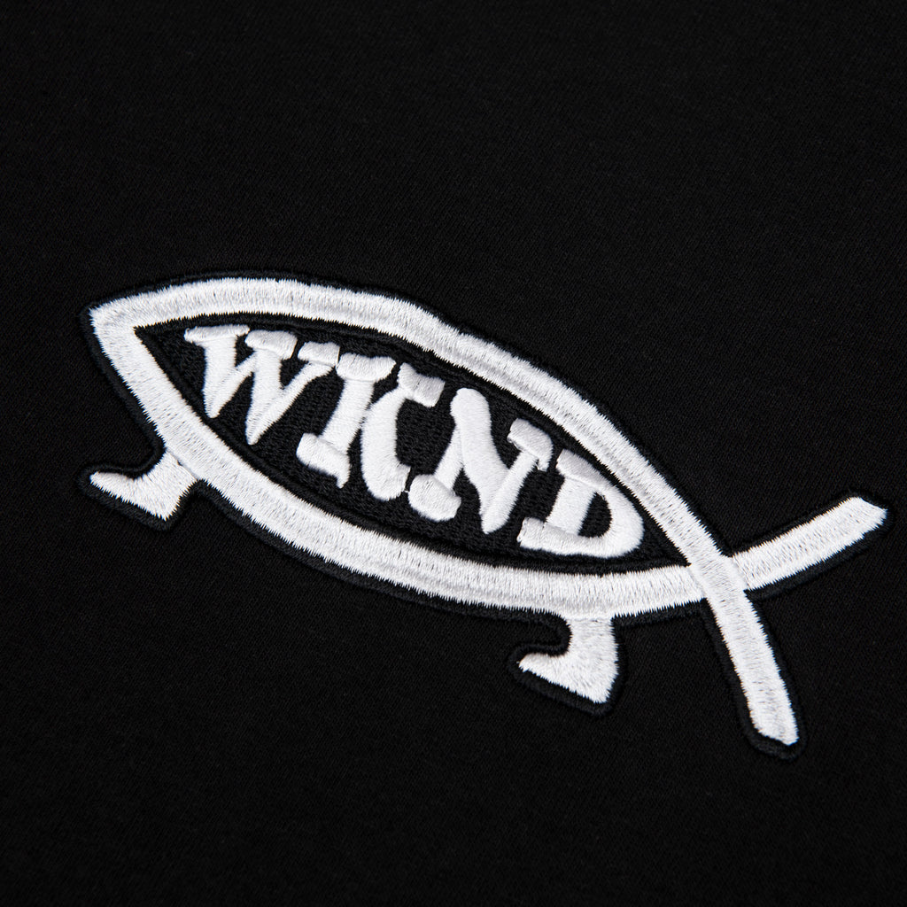 A WKND black shirt with a white fish logo on it.