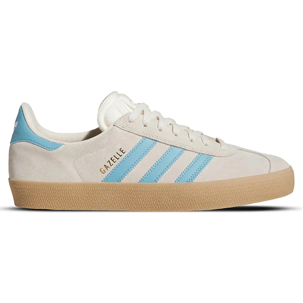 The ADIDAS GAZELLE ADV in Wonder White/Blue/Gum features a suede upper, light blue stripes, vulcanized rubber outsole, gum sole, and gold "GAZELLE" text on the side.