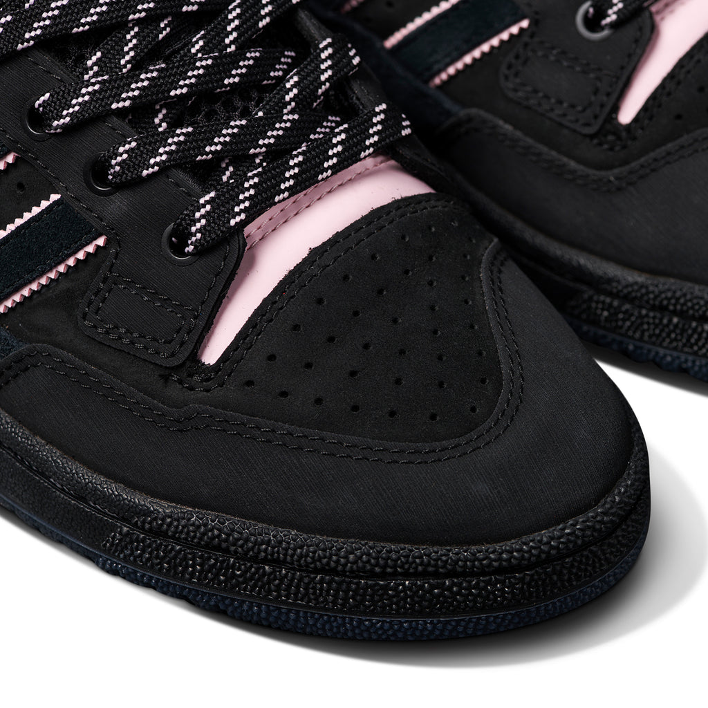 Close-up view of ADIDAS CENTENNIAL 85 LO ADV X LIL DRE black and pink skateboarding shoes with patterned laces and perforated detailing.