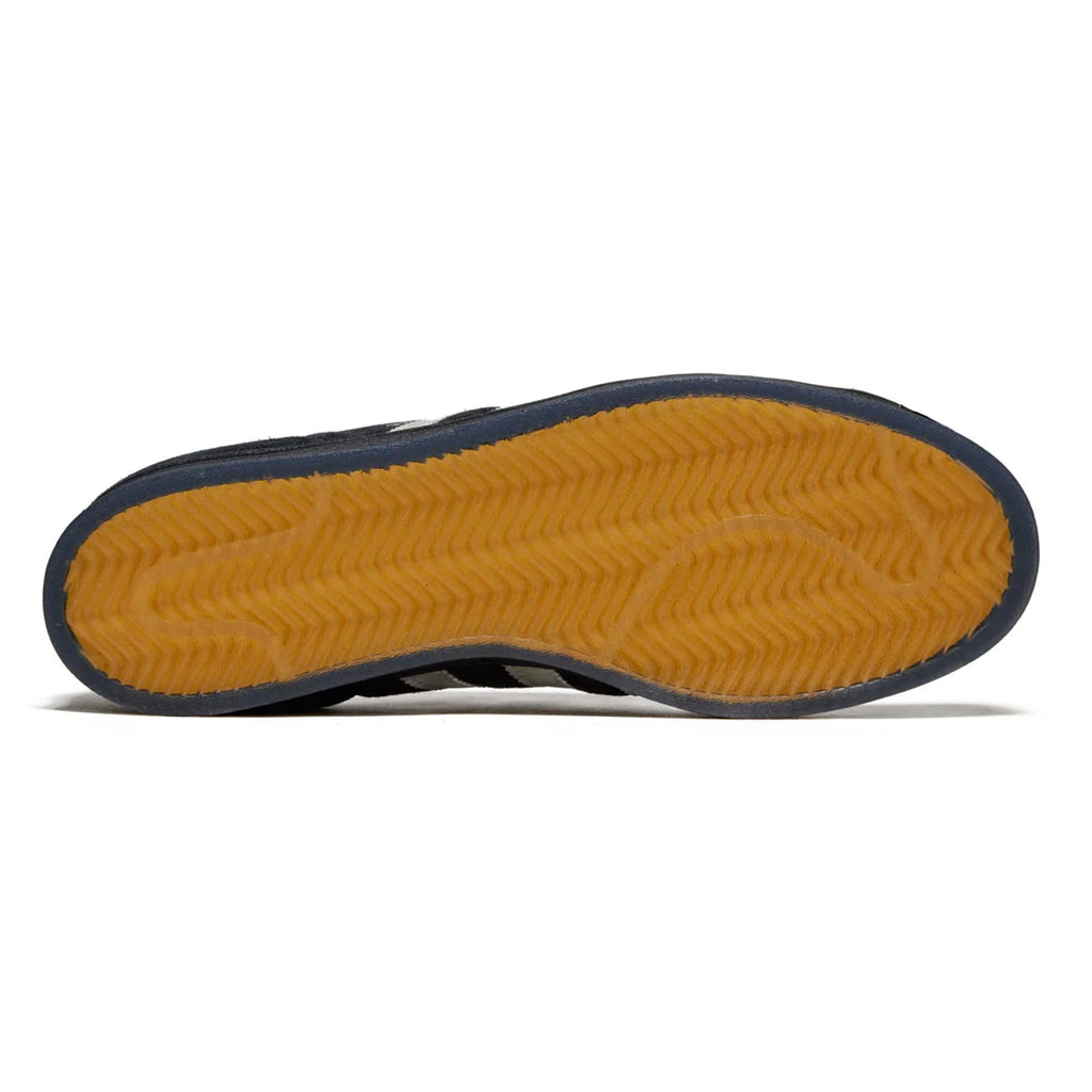 Bottom view of an Adidas shoe showing a navy blue edge and a textured yellow flexible cupsole with wave patterns.