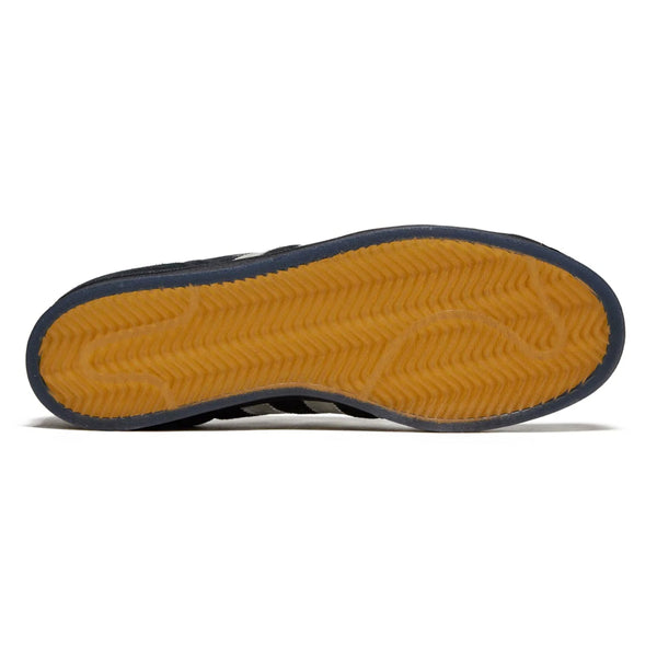 Bottom view of an Adidas shoe showing a navy blue edge and a textured yellow flexible cupsole with wave patterns.