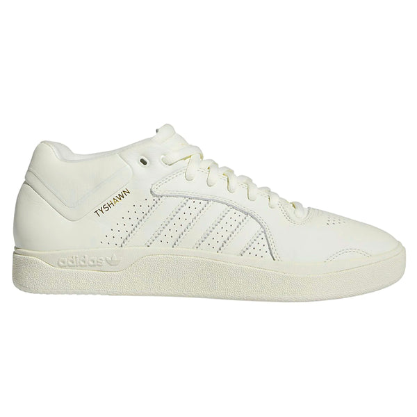 a monochromatic sneaker with Tyshawn's name written in gold metallic letters