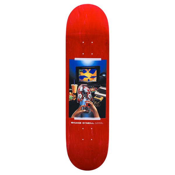 The APRIL SHANE O'NEILL VINTAGE 2 by APRIL is a red skateboard deck with artwork of hands tying laces in front of a monitor, keyboard, and snacks. "SHANE O'NEILL APRIL" is printed at the bottom.