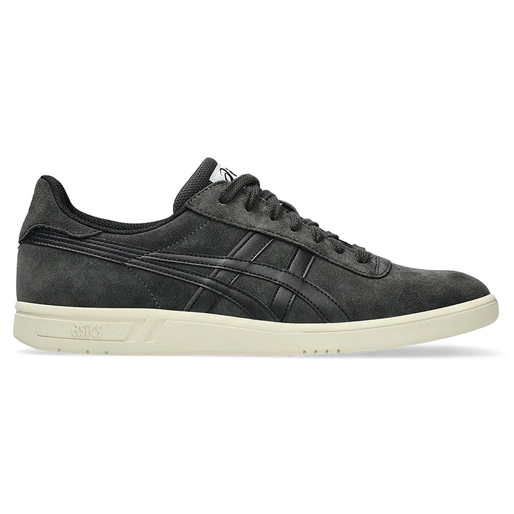 The ASICS GEL-VICKKA PRO GRAPHITE GREY / BLACK sneaker features a suede finish and low-top design, complemented by an off-white sole with GEL technology for comfort. It has a lace-up closure and side stripe detail, perfect for skateboarding enthusiasts.