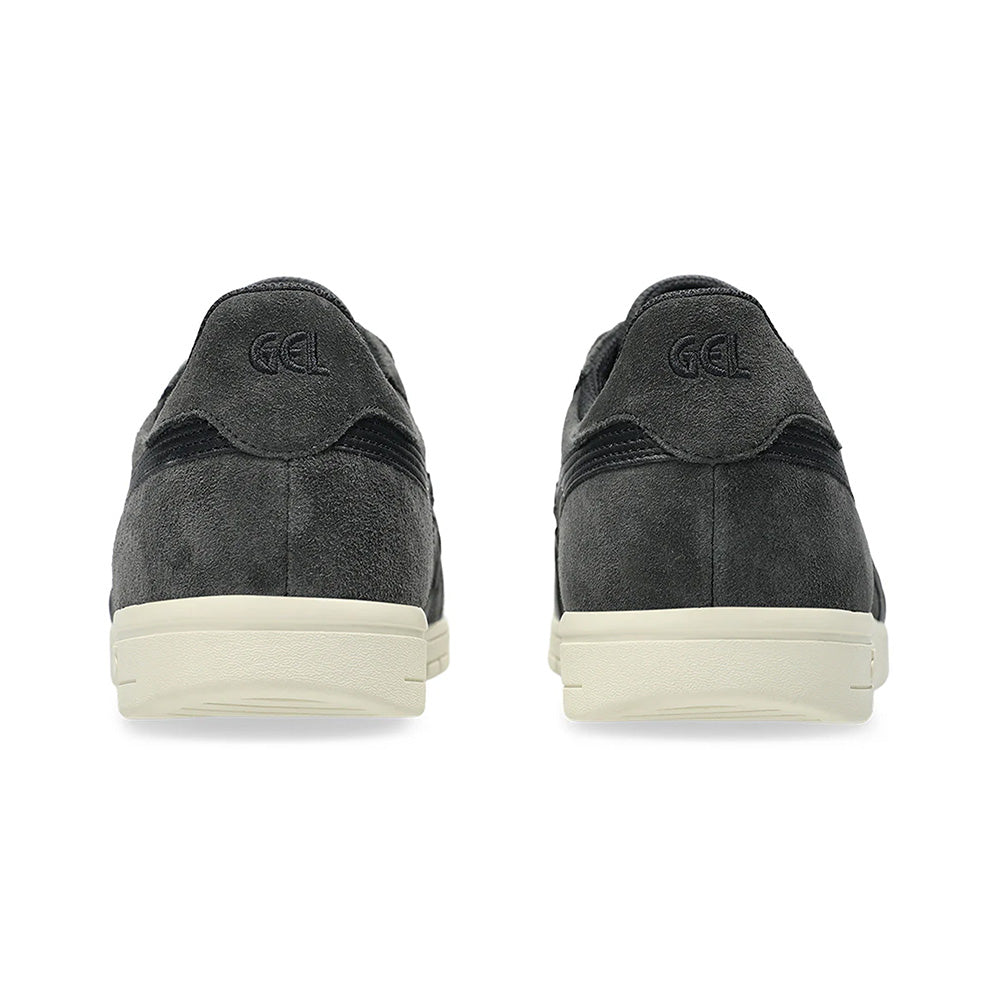 The ASICS GEL-VICKKA PRO GRAPHITE GREY/BLACK sneakers showcase a rear view with "GEL" embossed on the heel. These shoes feature white soles, black accents, and advanced GEL technology for superior comfort.