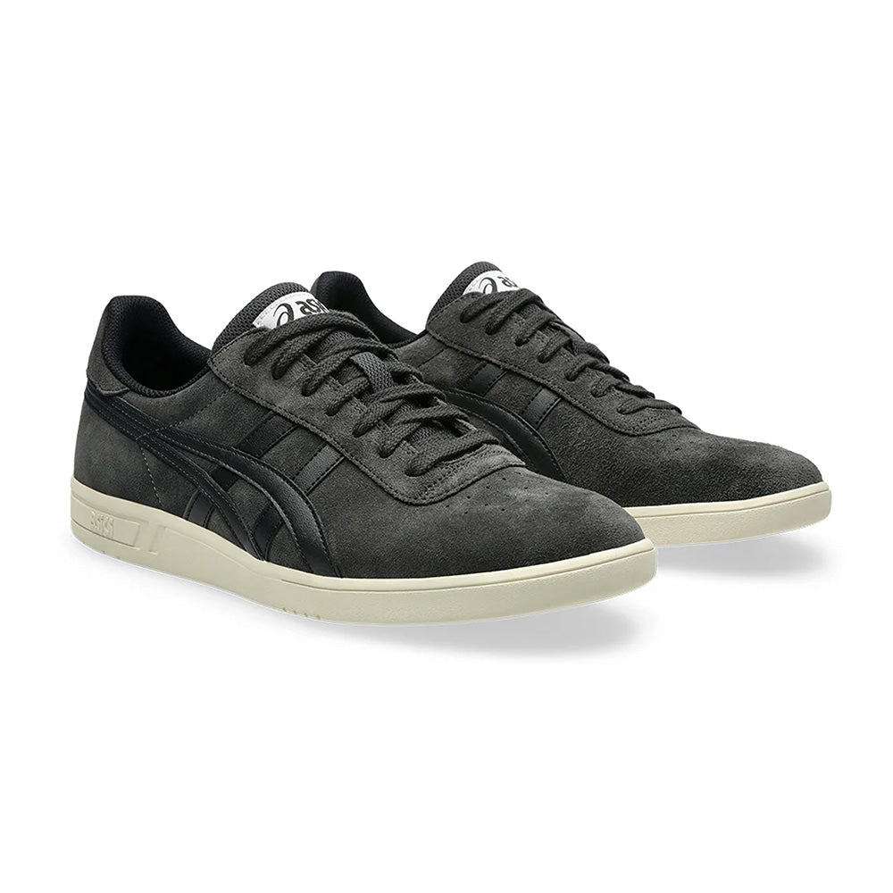 The ASICS GEL-VICKKA PRO in graphite grey/black, featuring sleek white soles and black accents with GEL technology for comfort, is depicted at an angle against a white background.