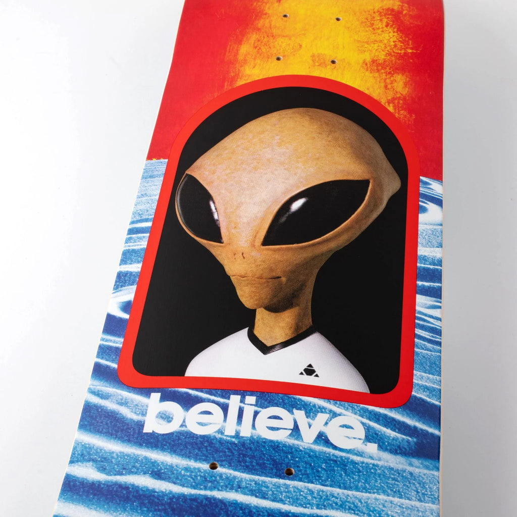 Graphic skateboard deck featuring an ALIEN WORKSHOP BELIEVE REALITY PLEXI LAM design with an alien head illustration and a dot fade effect, accompanied by the word "believe" below.