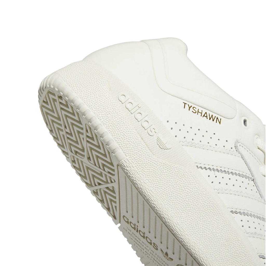 The shoe is made with ivory colored leather and a ivory colored rubber sole that has subtle bumpy textures for better skate grip