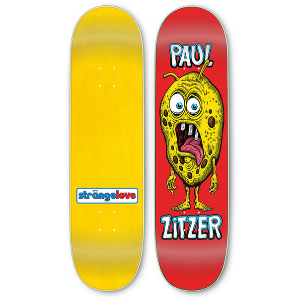Two STRANGE LOVE PAUL ZITZER skateboards, one plain yellow with a blue logo, the other featuring a cartoonish yellow monster yelling "pau!" and "Paul Zitzer.
