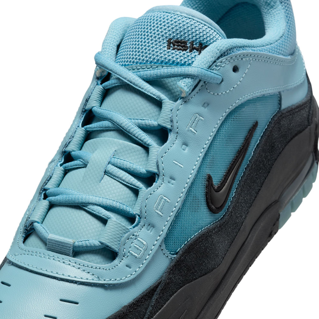 The NIKE SB ISHOD 2 AIR MAX in Denim Turq/Black showcases a detailed close-up of the sneaker featuring the Nike logo and lace-up design, with "AIR" text on the side, offering style and comfort for any fan.