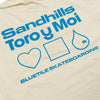 An ivory tee with blue words that say "Sandhills, Toro Y Moi, Bluetile Skateboarding" and a heart, square, and water drop.